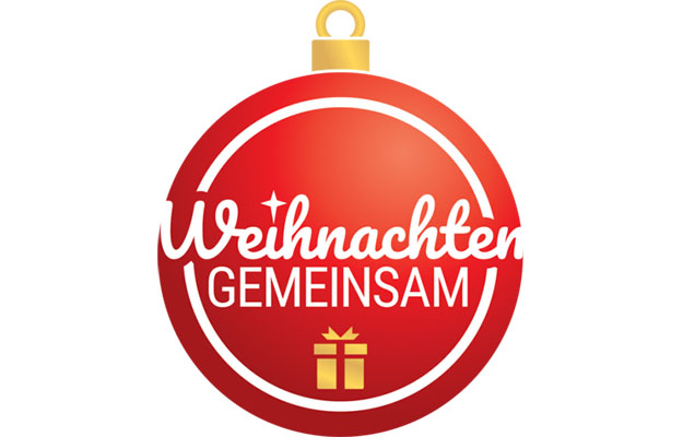 Ein rote Weihnachtskugel mit weißem Schriftzug - Weihnachten gemeinsam