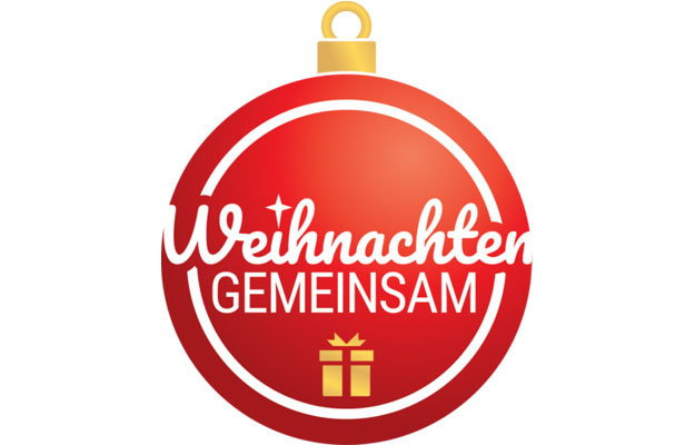Ein rote Weihnachtskugel mit weißem Schriftzug - Weihnachten gemeinsam